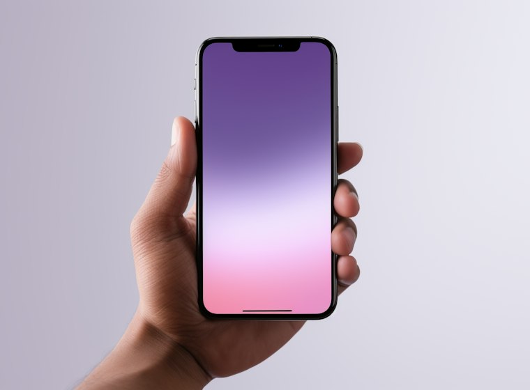 A hand holding a phone with a glowing purple screen