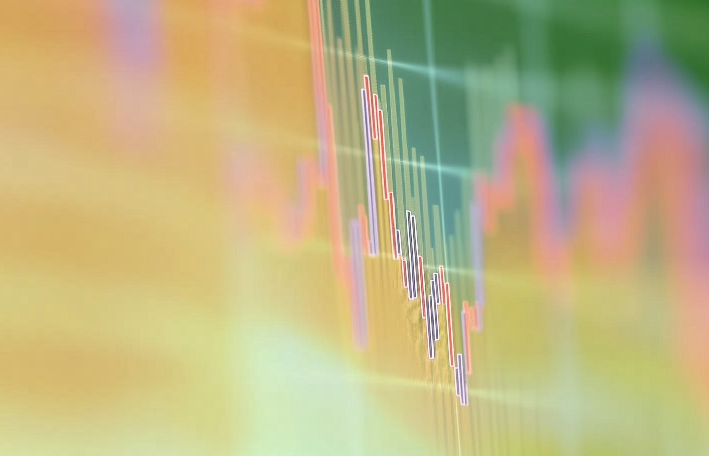 A blurred candlestick chart on a trading screen